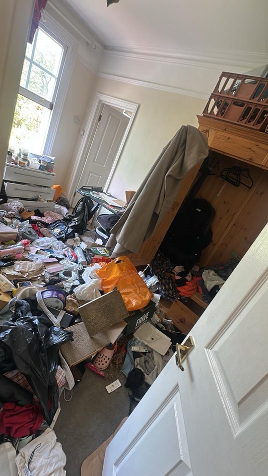 Cluttered bedroom before the Sky Prime clearance and deep clean